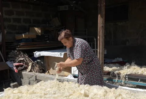 Postcard from Masis: A life stitched back together