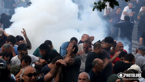 Police use stun grenades on protesters