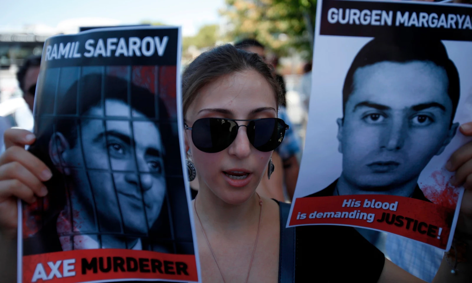 An Armenian protester holds pictures of Ramil Safarov and Gurgen Margaryan, 2012. Photo: Petros Karadjias / AP An Armenian protester holds pictures of Ramil Safarov and Gurgen Margaryan, 2012. Photo: Petros Karadjias / AP