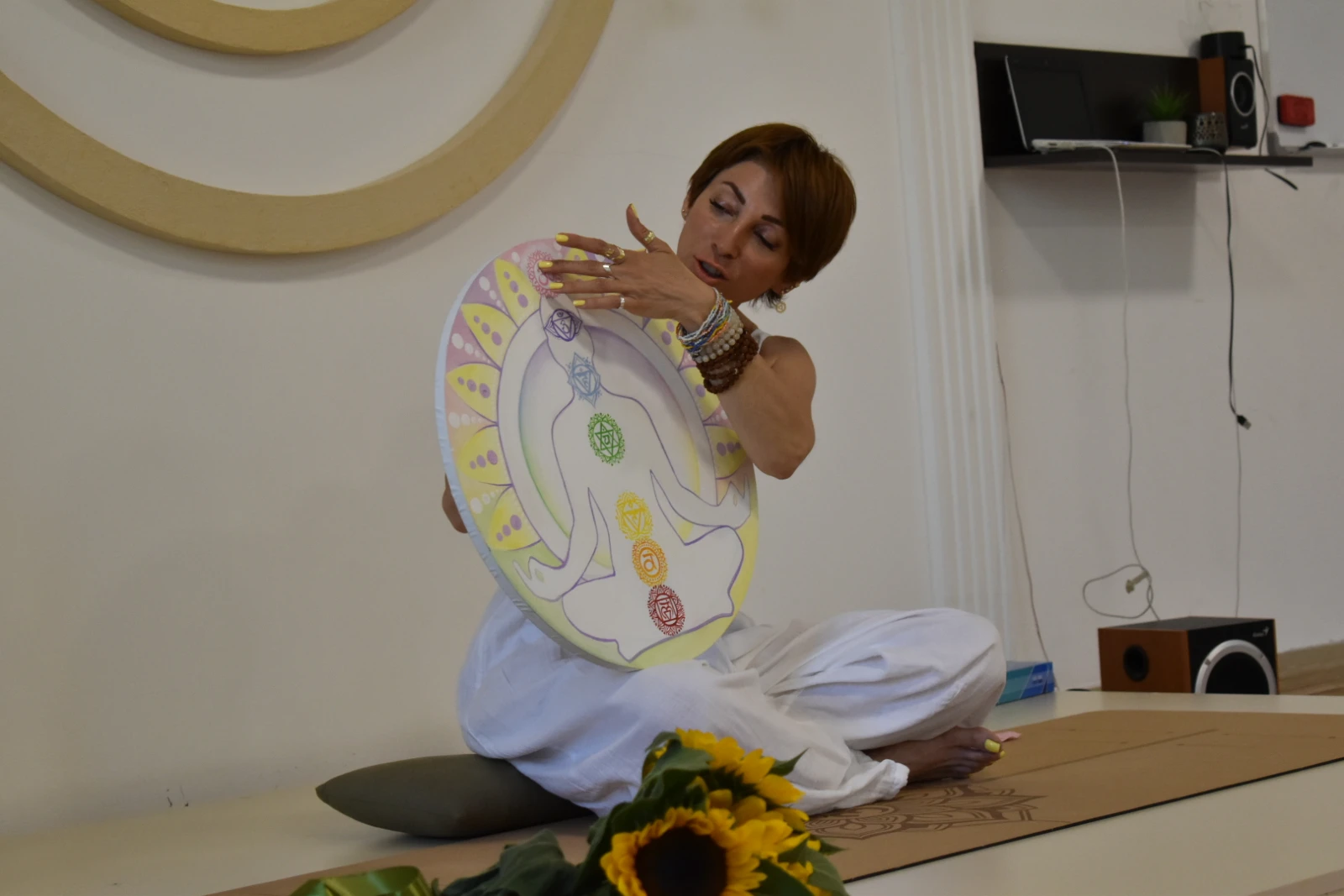 Narina Bagdasarayan teaches her students about the seven chakras. (PHOTO: Olivia Law)