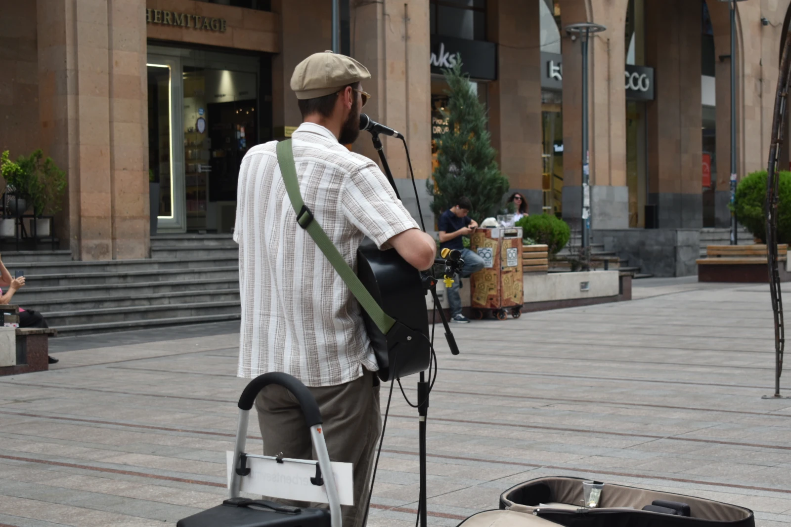 A street performer plays on Northern Avenue. A street performer plays on Northern Avenue.