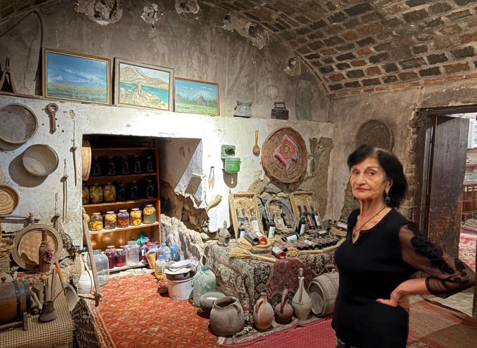 Marieta in the basement of her house-museum in Kond.
