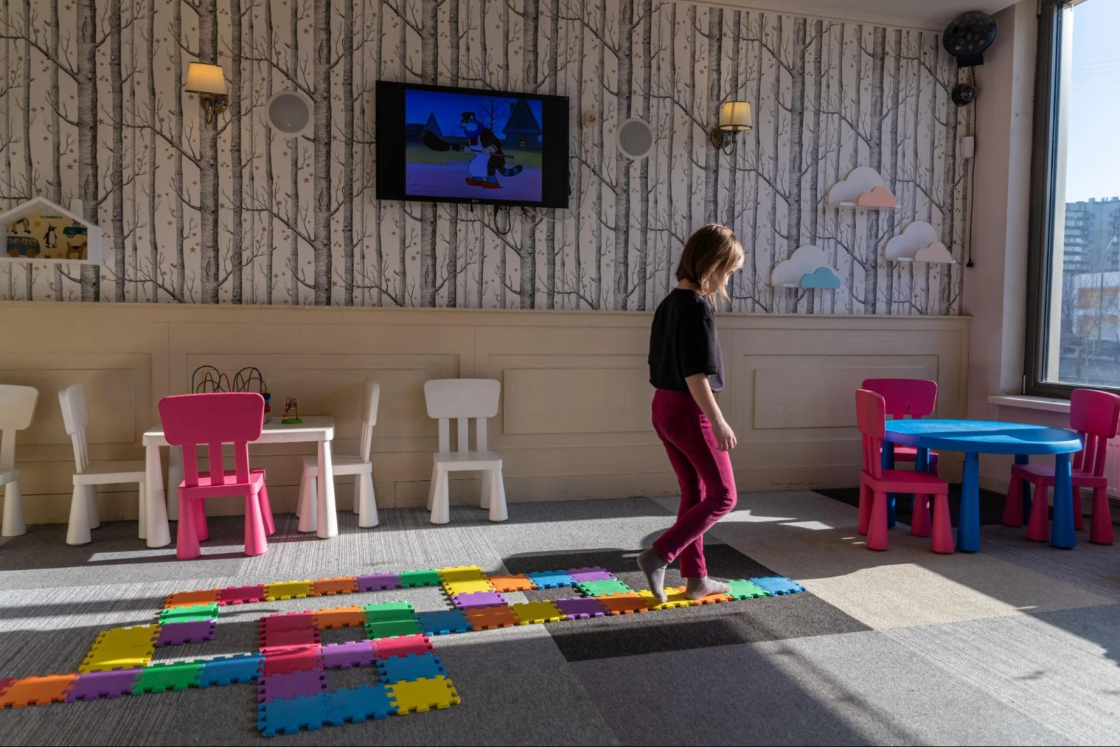 Photo: Child walking on a colorful trail in a kindergarten